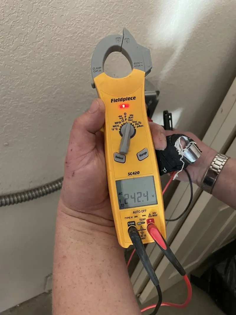 Voltage testing with clamp meter during Generator Installation in Mount Juliet
